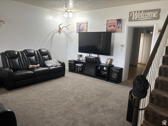 living area with a textured ceiling, stairway, and carpet