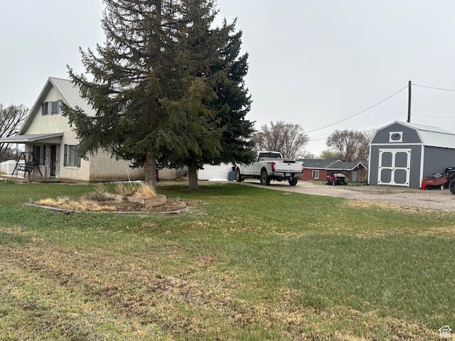 view of yard with a storage unit and an outdoor structure