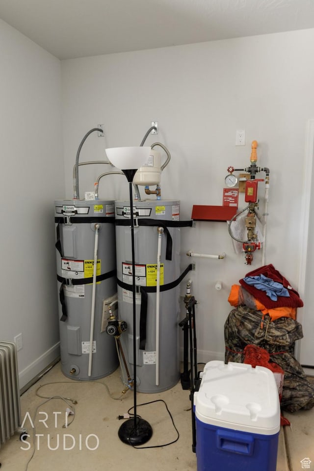 utility room with radiator heating unit and strapped water heater