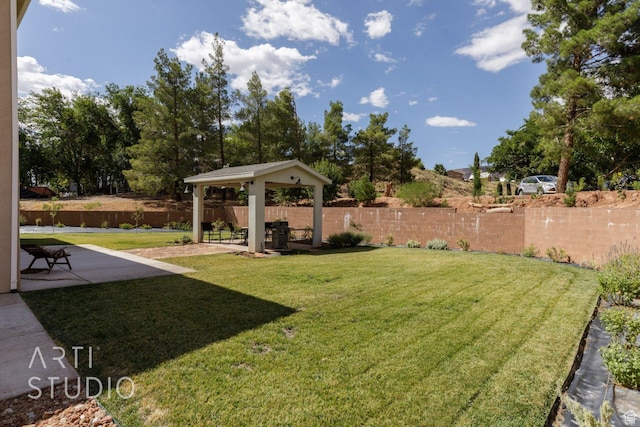 view of yard featuring a gazebo, fence, and a patio