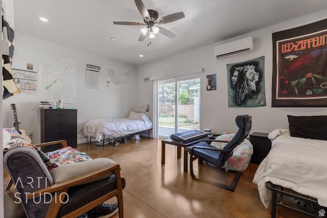 bedroom featuring access to exterior, a ceiling fan, a wall mounted air conditioner, concrete flooring, and recessed lighting