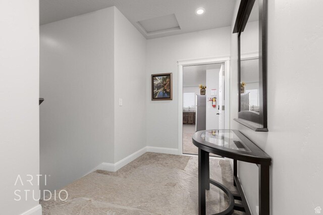 hall with baseboards, carpet floors, and recessed lighting