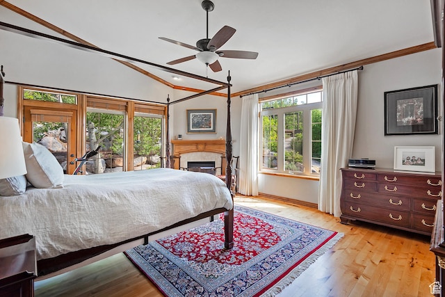 5888 E Pioneer Fork Rd N, Salt Lake City, UT 84108 - bedroom with light wood-style floors, a glass covered fireplace, lofted ceiling, and ceiling fan