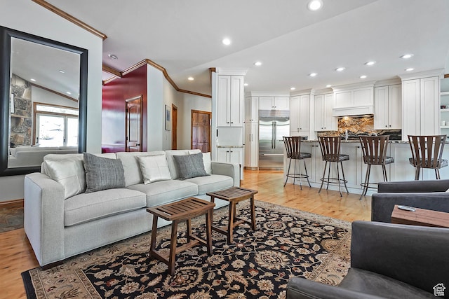 5888 E Pioneer Fork Rd N, Salt Lake City, UT 84108 - living room with light wood finished floors, decorative columns, recessed lighting, and ornamental molding