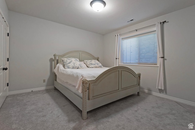 5888 E Pioneer Fork Rd N, Salt Lake City, UT 84108 - bedroom featuring baseboards, visible vents, and light carpet