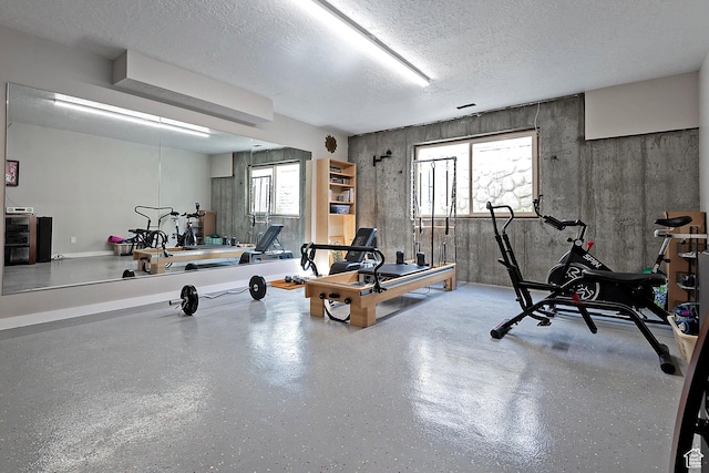 5888 E Pioneer Fork Rd N, Salt Lake City, UT 84108 - exercise room featuring a textured ceiling