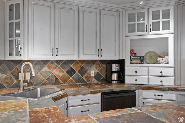 5888 E Pioneer Fork Rd N, Salt Lake City, UT 84108 - kitchen with white cabinets, a sink, and tasteful backsplash