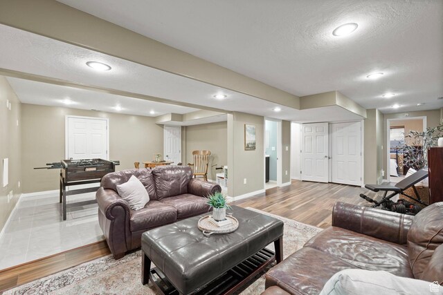 13968 S Hawberry Rd E, Draper, UT 84020 - living area with baseboards, light wood-style floors, recessed lighting, and a textured ceiling