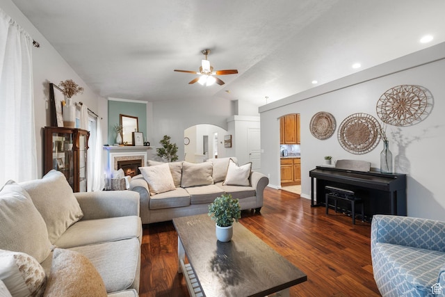 13968 S Hawberry Rd E, Draper, UT 84020 - living room featuring dark wood finished floors, lofted ceiling, arched walkways, and ceiling fan