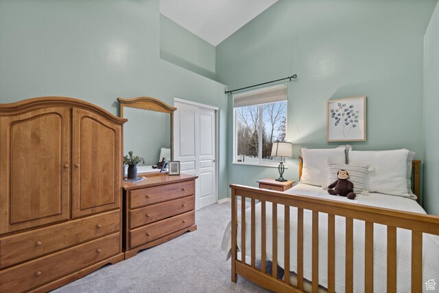 13968 S Hawberry Rd E, Draper, UT 84020 - bedroom featuring a closet, high vaulted ceiling, and light colored carpet