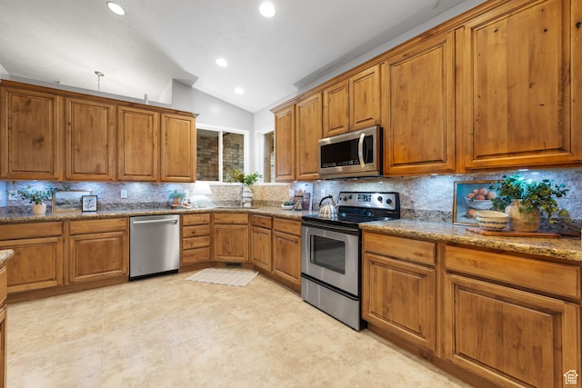 13968 S Hawberry Rd E, Draper, UT 84020 - kitchen featuring lofted ceiling, decorative backsplash, stone countertops, appliances with stainless steel finishes, and brown cabinetry