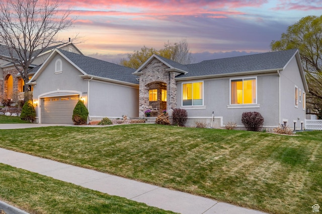 13968 S Hawberry Rd E, Draper, UT 84020 - view of front of house with driveway, stucco siding, a yard, and an attached garage