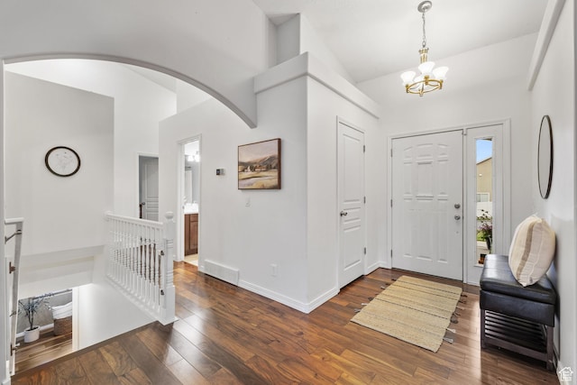 13968 S Hawberry Rd E, Draper, UT 84020 - entryway with baseboards, a chandelier, arched walkways, dark wood-style floors, and visible vents