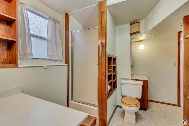 full bath featuring a shower stall, baseboards, toilet, and a sink