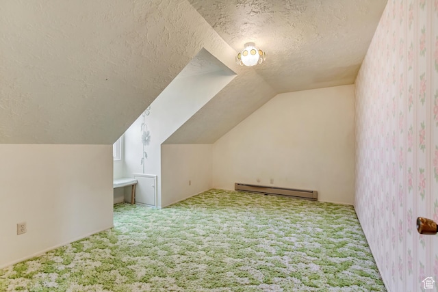 bonus room featuring carpet floors, a textured ceiling, vaulted ceiling, and a baseboard heating unit