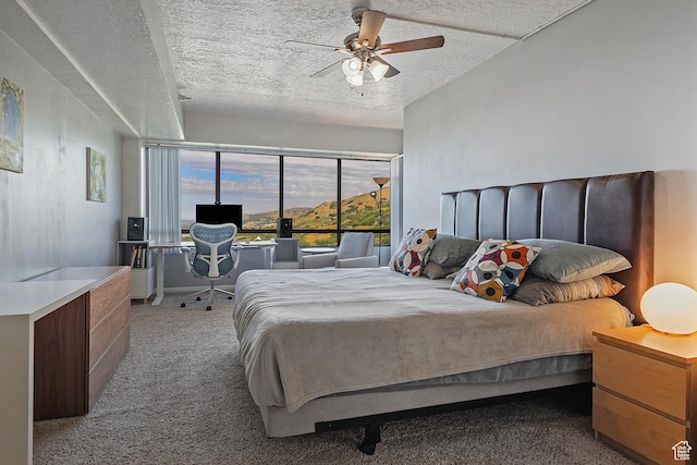 3125 E Kennedy Dr S Unit 605, Salt Lake City, UT 84108 - bedroom with carpet floors, ceiling fan, and a textured ceiling