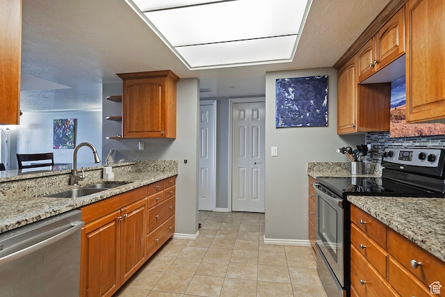 3125 E Kennedy Dr S Unit 605, Salt Lake City, UT 84108 - kitchen featuring a sink, stainless steel appliances, light tile patterned floors, and light stone counters