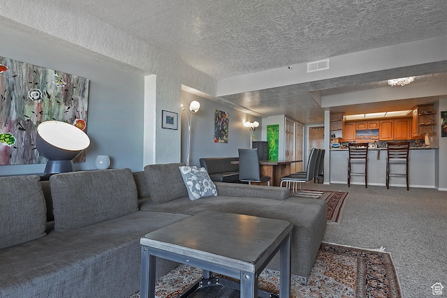 3125 E Kennedy Dr S Unit 605, Salt Lake City, UT 84108 - carpeted living room with a textured wall, a textured ceiling, baseboards, and visible vents
