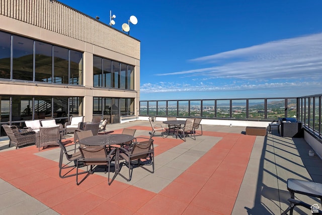 3125 E Kennedy Dr S Unit 605, Salt Lake City, UT 84108 - view of patio / terrace with a balcony, an outdoor living space, and outdoor dining space