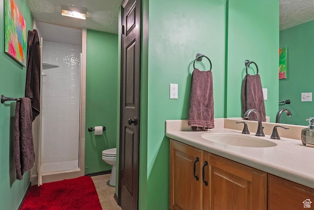3125 E Kennedy Dr S Unit 605, Salt Lake City, UT 84108 - full bathroom featuring a tile shower, toilet, vanity, and a textured ceiling