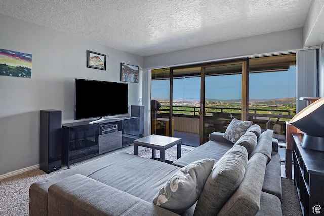 3125 E Kennedy Dr S Unit 605, Salt Lake City, UT 84108 - carpeted living room featuring baseboards and a textured ceiling