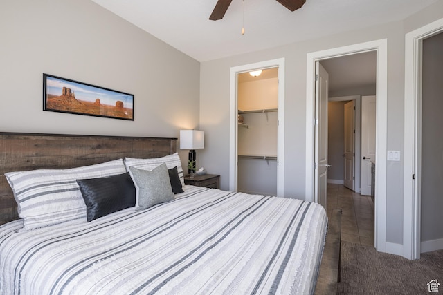 429 N 600 W, Moab, UT 84532 - carpeted bedroom featuring baseboards, ceiling fan, a walk in closet, and a closet