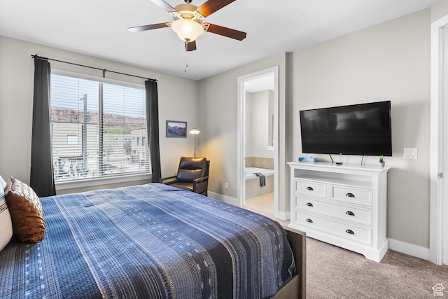 429 N 600 W, Moab, UT 84532 - bedroom featuring baseboards, connected bathroom, a ceiling fan, and light carpet
