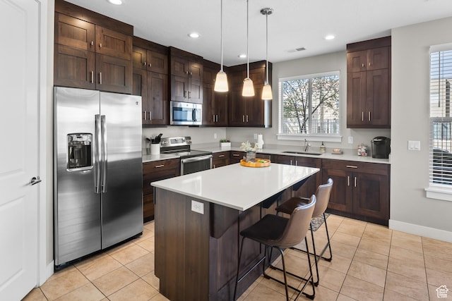 429 N 600 W, Moab, UT 84532 - kitchen featuring light countertops, a sink, appliances with stainless steel finishes, visible vents, and dark brown cabinets