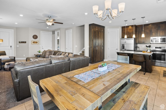 429 N 600 W, Moab, UT 84532 - dining room with ceiling fan with notable chandelier, recessed lighting, stairway, and light tile patterned floors