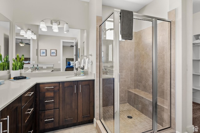 429 N 600 W, Moab, UT 84532 - ensuite bathroom with a stall shower, tile patterned floors, ceiling fan, and vanity
