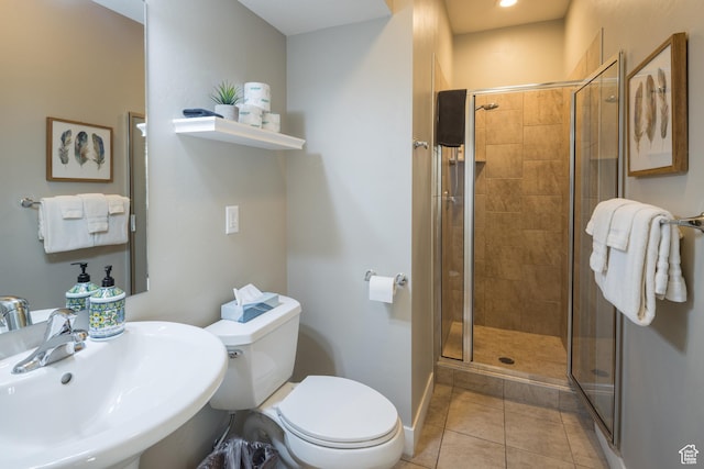 429 N 600 W, Moab, UT 84532 - bathroom with toilet, a sink, a stall shower, and tile patterned floors