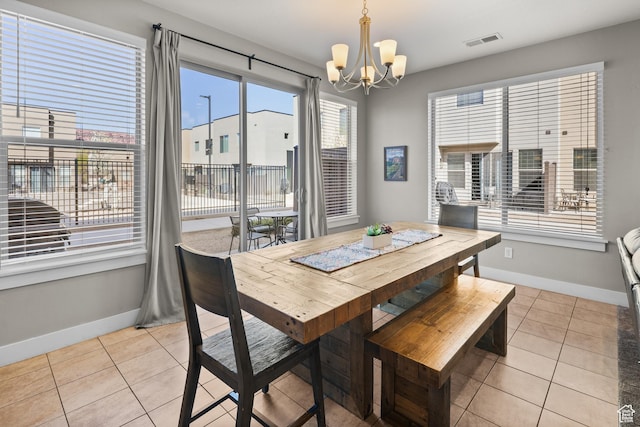 429 N 600 W, Moab, UT 84532 - dining space with baseboards, visible vents, a chandelier, and light tile patterned floors