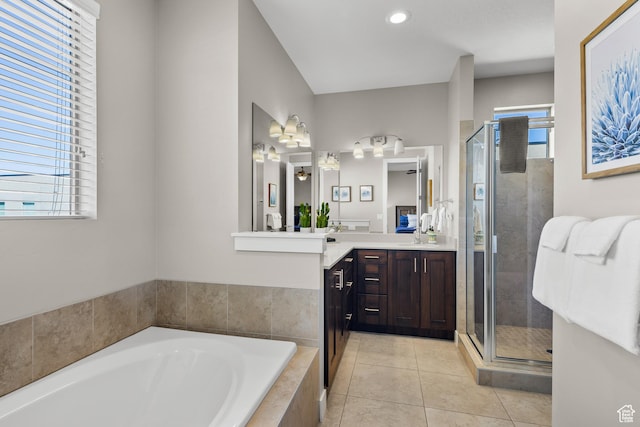 429 N 600 W, Moab, UT 84532 - bathroom featuring a bath, a healthy amount of sunlight, tile patterned floors, and a stall shower