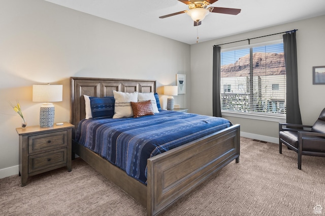 429 N 600 W, Moab, UT 84532 - bedroom featuring light colored carpet, visible vents, baseboards, and a ceiling fan