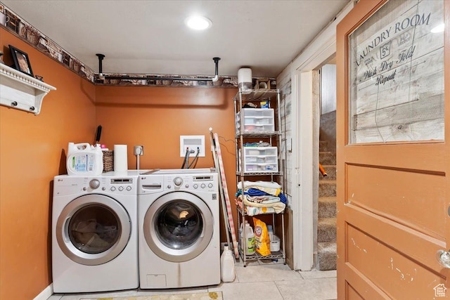 laundry area featuring independent washer and dryer, laundry area, and tile patterned floors