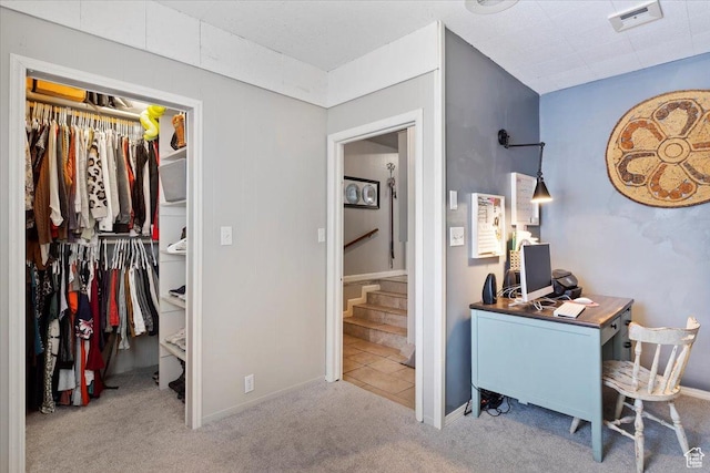 interior space with baseboards, a closet, and visible vents