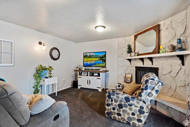 carpeted living area featuring a fireplace