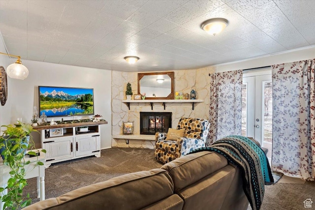carpeted living area featuring a fireplace