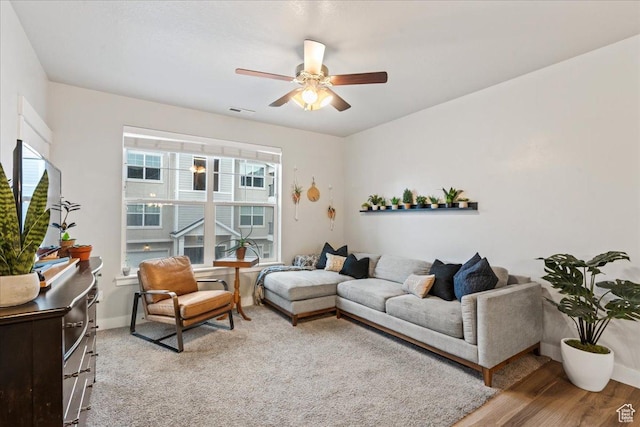 14506 S Ronan Ln Unit 203, Herriman, UT 84096 - living area featuring baseboards, visible vents, wood finished floors, and a ceiling fan
