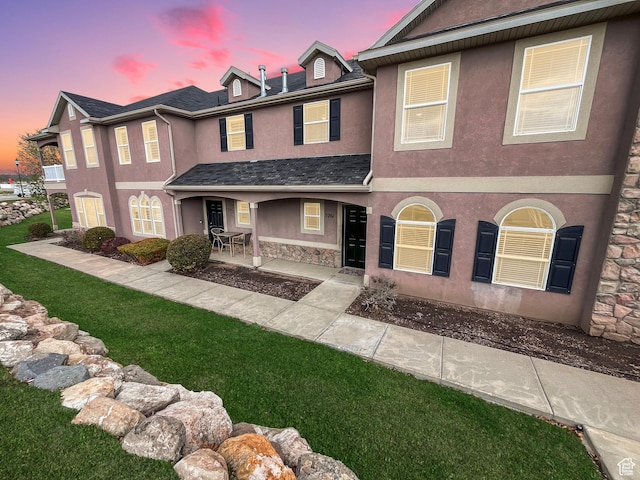 5262 W Cool Water Way, West Jordan, UT 84081 - view of front of house with a front yard, stucco siding, and stone siding