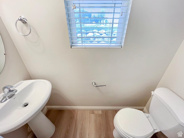 5262 W Cool Water Way, West Jordan, UT 84081 - half bathroom with toilet, a sink, baseboards, and wood finished floors