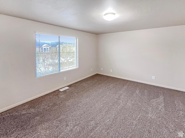 5262 W Cool Water Way, West Jordan, UT 84081 - carpeted spare room with baseboards, visible vents, and a textured ceiling