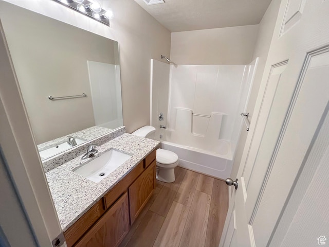 5262 W Cool Water Way, West Jordan, UT 84081 - bathroom featuring visible vents, toilet, wood finished floors, vanity, and bathing tub / shower combination