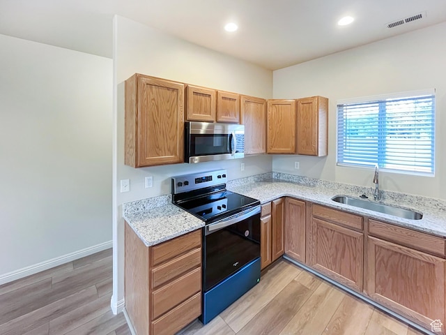5262 W Cool Water Way, West Jordan, UT 84081 - kitchen featuring light wood-style flooring, a sink, stainless steel appliances, and visible vents