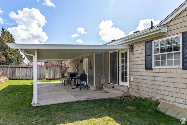 view of patio with fence and entry steps