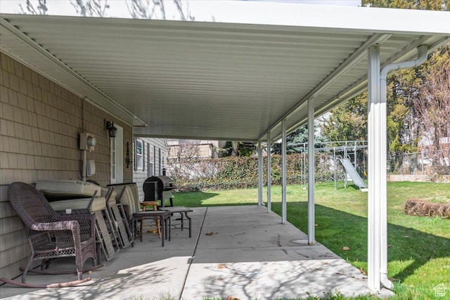 view of patio featuring fence