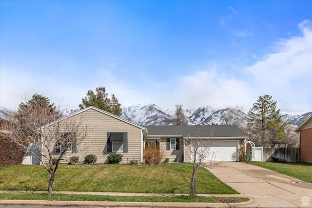 single story home with driveway, a garage, a front lawn, and fence