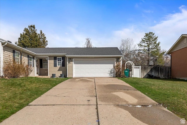 ranch-style house with an attached garage, fence, concrete driveway, and a front yard