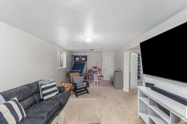 living room with light colored carpet and a textured ceiling