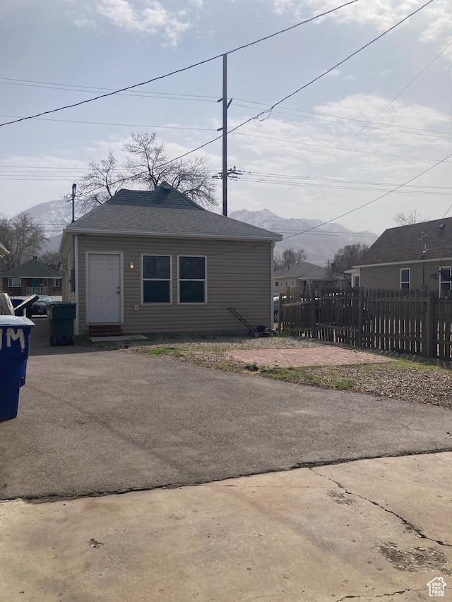 2855 Lincoln Ave, Ogden, UT 84401 - view of front of house with driveway, fence, and a mountain view